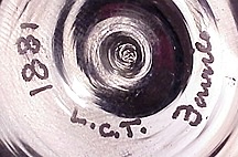 A typical Tiffany Studios signature with a shape number
