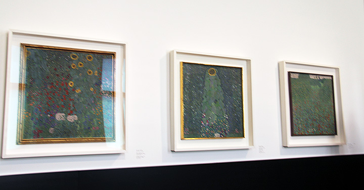One wall with three Klimt floral paintings