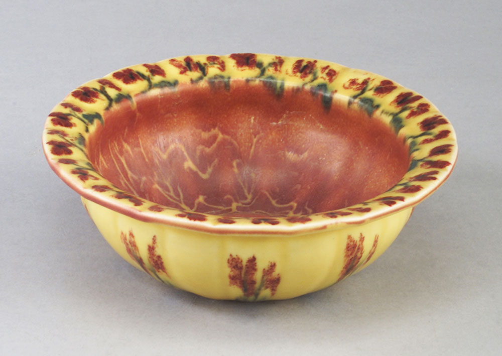 Unusual Rookwood Wax Matte bowl painted by Louise Abel with red blossoms on a mustard ground, the interior covered in a mottled burnt sienna glaze, 1924. Sale Price: $764, Rago Arts & Auction Center